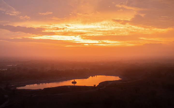 Sunset over a restored landscape with a lake at its centre